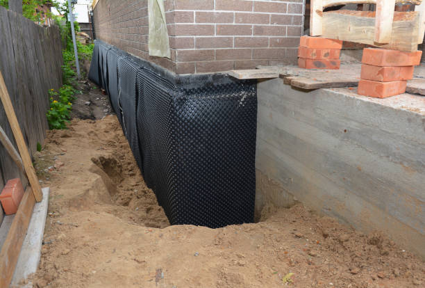 SJ Waterproofing Pros technician performing targeted Waterproofing assessment in Downingtown, PA